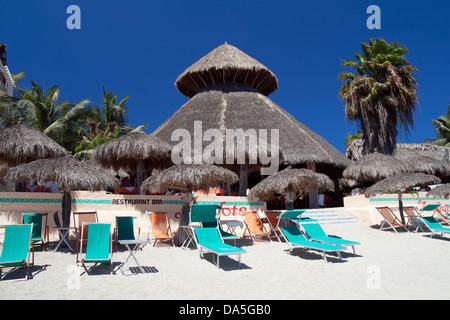 Beach chairs and palapas at a resort in Punta Mita, Mexico. Stock Photo