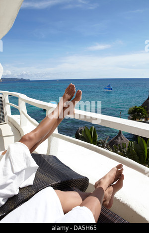 A couple relaxing on a balcony. Stock Photo
