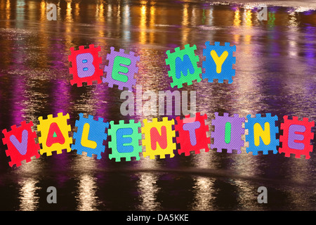 This is love note Be my Valentine, with river surface in background. Stock Photo