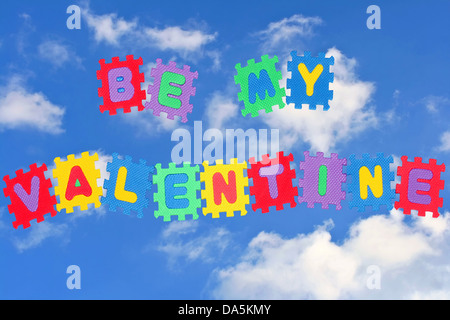 This is love note Be my Valentine, with sky and clouds in background. Stock Photo