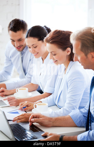group of people working with laptops in office Stock Photo
