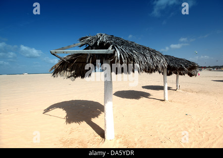 umbrella in desert under blue sky Stock Photo