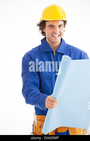 Portrait of a young construction worker smiling with blueprint. Isolated on white. Looking at camera. Stock Photo