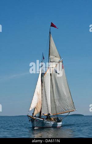 The passenger cruise schooner Timberwind sailing in Penobscot Bay outside the breakwater at Rockland Maine, bow and port view Stock Photo