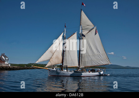 The passenger cruise schooner Timberwind sailing past Breakwater Lighthouse in Rockland Harbor, Rockland Maine, port side view Stock Photo