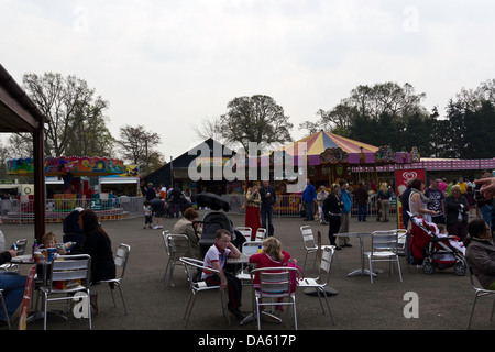 Eating and drinking at tables inside the Blair Drummond Safari animal park in Scotland, a tourist park with animals Stock Photo