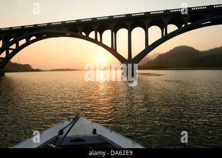 USA, United States, America, North America, Pacific Northwest, Oregon, Coast, Rogue river, river, bridge, morning, sunrise, mist Stock Photo