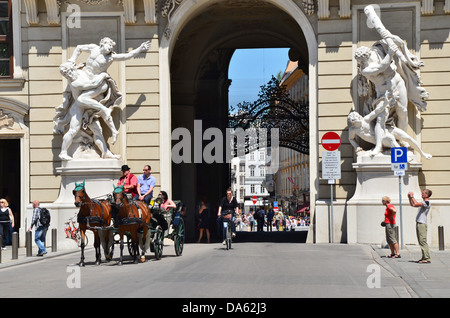 The fiakers, horse-drawn carriages, which have transported people round Vienna for centuries, are still popular with tourists. Stock Photo