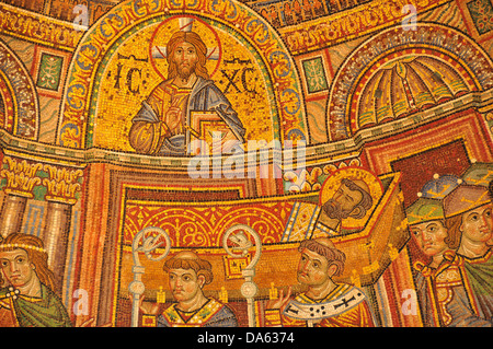 golden mosaic of Jesus Christ enthroned with the tonsured body of Saint Mark on a bier carried by Venetians from St Mark's Basil Stock Photo