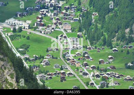 The pcituresque  swiss mountain village of Randa near Zermatt in the summer. with well spaced chalets and well cut grass nestlin