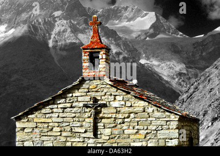 an old chapel in the mountains, with small bell tower, and mountains in the background, weisshorn, Stock Photo