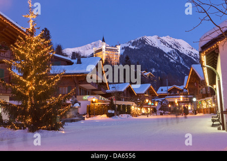 Gstaad, winter, village, night, dark, canton, Bern, Bernese Oberland, Switzerland, Europe, Palace, lamp, lights, Christmas tree, Stock Photo