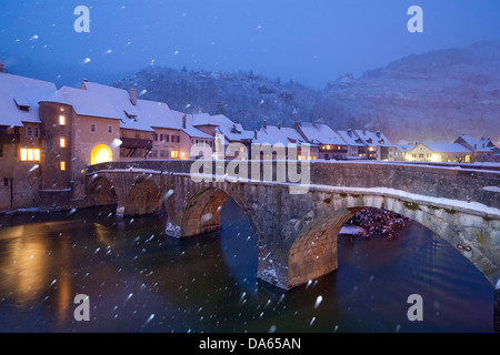 Saint Ursanne, Jura, canton, JU, village, snow, winter, river, flow, brook, body of water, water, bridge, Switzerland, Europe, a Stock Photo
