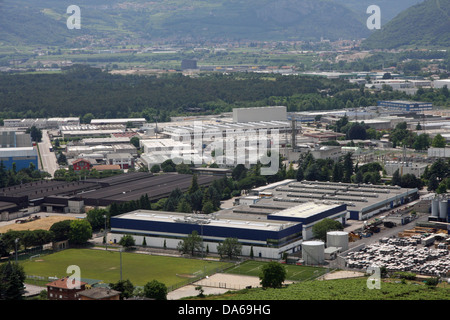 Aerial view of a populous city with many houses and large factories in the industrial zone Stock Photo