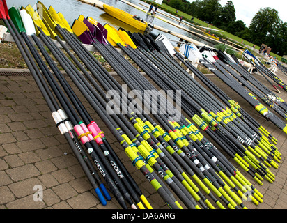 A collection of oars on a rack ready for use in a regatta.