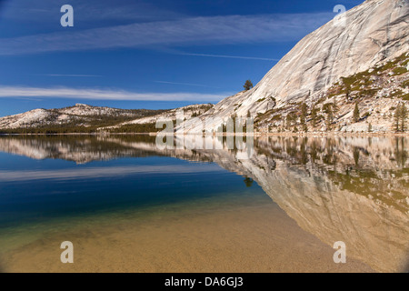 Granite rocks being reflected in Tenaya Lake Stock Photo