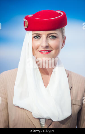 London, UK. 5th July, 2013. an Emirates Airline hostess smiles to camera during the official opening of the new Emirates Aviation Experience with the President of Emirates Airline, Tim Clark and the Mayor of London Boris Johnson Credit:  Piero Cruciatti/Alamy Live News Stock Photo