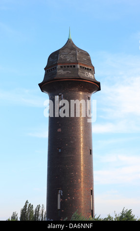 Ostkreuz station tower in Berlin ,Germany.A large dark colored tower was built to store water for steam trains Stock Photo