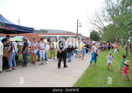 People queuing in a park on June 23, 2013 in Toronto, Canada Stock Photo