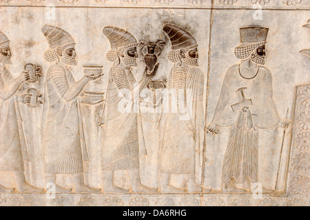 Bas reliefs at the walls of Apadana Palace and Staircase, Persepolis, Central Iran Stock Photo