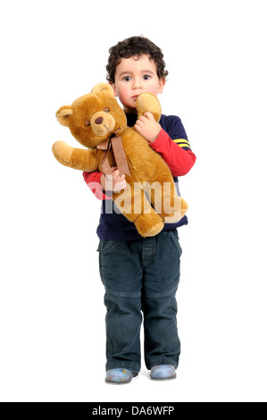 Young boy with teddy bear isolated in white Stock Photo - Alamy