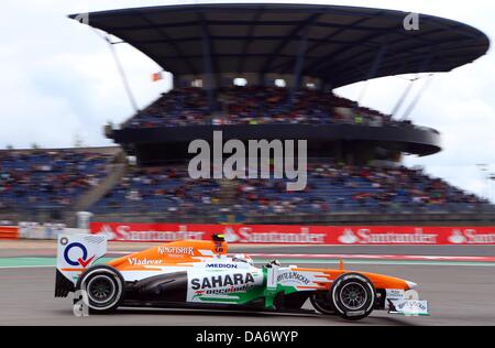 Nuerburg, Germany. 05th July, 2013. British Formula One driver Paul di Resta of Force India steers his car in front of Mercedes tribune during the second practice session at the Nuerburgring circuit in Nuerburg, Germany, 05 July 2013. The Formula One Grand Prix of Germany will take place on 07 July 2013. Photo: Jens Buettner/dpa/Alamy Live News Stock Photo
