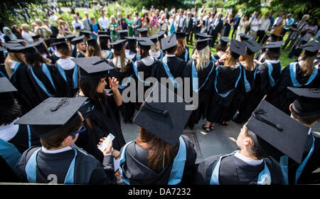 Birmingham, UK. 05th July, 2013. University of Birmingham students after their graduation ceremony.  Over 1500 students will graduate this year from the red brick university. Credit:  John James/Alamy Live News Stock Photo