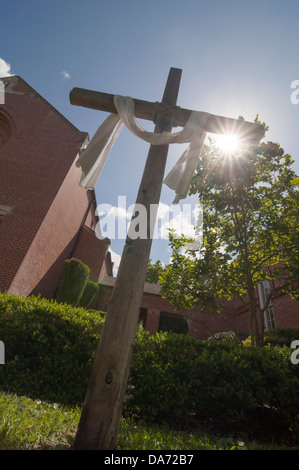 Christian Cross erected by a nearby Methodist Church hovers over the annual Spring Arts Festival in Gainesville Florida. Stock Photo