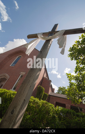 Christian Cross erected by a nearby Methodist Church hovers over the annual Spring Arts Festival in Gainesville Florida. Stock Photo