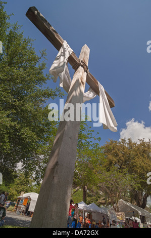 Christian Cross erected by a nearby Methodist Church hovers over the annual Spring Arts Festival in Gainesville Florida. Stock Photo