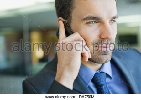 Close-up of businessman using mobile phone