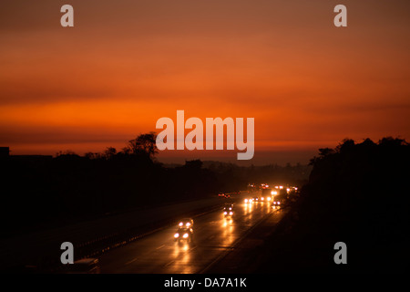 The Pune Mumbai expressway looks magical in the setting sun with vehicles moving around at great speed is a venue for accidents Stock Photo