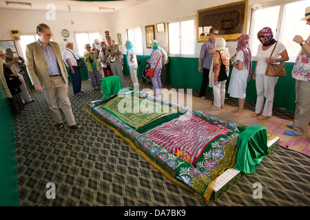 Oman, Salalah, Dhofar, Jabal Auara, visitors inside Job’s Tomb, Nabi Ayoub, tour group Stock Photo