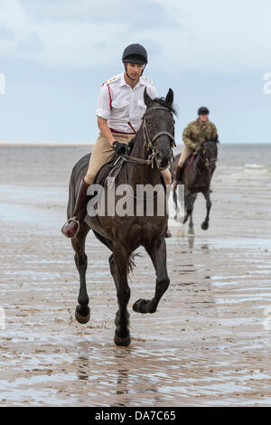 Holkham, Norfolk, UK. 4th July, 2013. The Household cavalry - Two members of the  Lifeguards riding on Holkham beach in North Norfolk during their annual summer camp. Holkham. North Norfolk.England.04 July 2013 Credit:  David Osborn/Alamy Live News Stock Photo