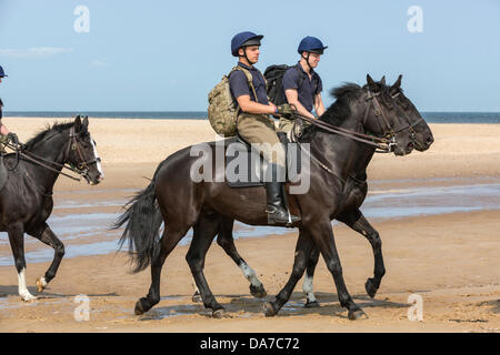 Holkham, Norfolk, UK. 4th July, 2013. The Household cavalry - Riders of the Blues and Royals riding on Holkham beach in North Norfolk during their annual summer camp. Holkham. North Norfolk.England. 05 July 2013 Credit:  David Osborn/Alamy Live News Stock Photo