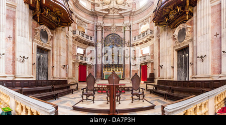 Altar of the Basilica of the Mafra Palace and Convent in Portugal. Franciscan religious order. Baroque architecture. Stock Photo