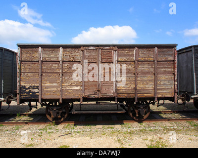 This image showcases a Danish railroad car from the Mariager-Handest Veteranjernbane, a heritage railway in Denmark. The vintage railcar, also known as a railway carriage or wagon, is part of the preserved fleet that offers historical train rides along scenic routes in Denmark. Stock Photo