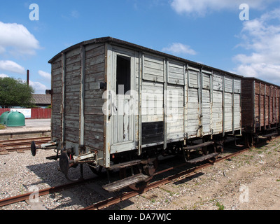 This image features the Mariager-Handest Veteranjernbane, a Danish vintage railroad car from the early 20th century. The carriage, numbered -019, is part of the preserved historic railway used for public displays and tourism, offering a glimpse into Denmark’s railway history. Stock Photo