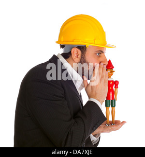 Businessman with Pinocchio on white background Stock Photo