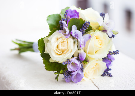 Wedding bouquet with yellow roses and lavender flowers Stock Photo