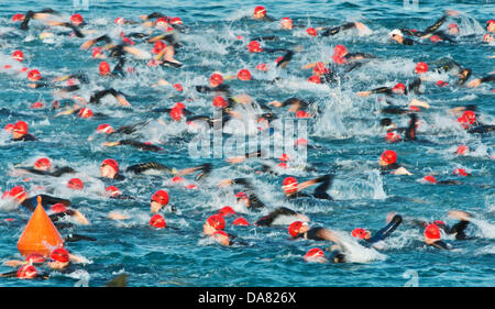 Frankfurt, Germany. 07th July, 2013. the Ironman sports competition in Frankfurt, Germany. 7th July, 2013. More than 2.600 participants take part in the Ironman sports competition in Frankfurt, Germany, 7 July 2013. Particiaptns from 55 countries are competing on a race course which includes 3.8 kilometres of swimming, 180 kilometres of cycling and 42.195 kilometres of running.  Credit:  dpa picture alliance/Alamy Live News Stock Photo