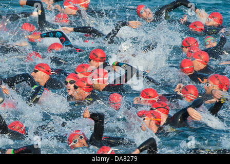 Frankfurt, Germany. 07th July, 2013. the Ironman sports competition in Frankfurt, Germany. 7th July, 2013. More than 2.600 participants take part in the Ironman sports competition in Frankfurt, Germany, 7 July 2013. Particiaptns from 55 countries are competing on a race course which includes 3.8 kilometres of swimming, 180 kilometres of cycling and 42.195 kilometres of running.  Credit:  dpa picture alliance/Alamy Live News Stock Photo