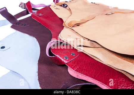 welder apron in color white, brown. red and yellow Stock Photo