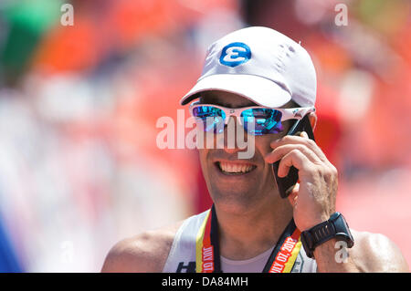 Frankfurt Main, Germany. 07th July, 2013. Eneko Llanos from Spain wins the Ironman in Frankfurt Main, Germany, 07 July 2013. The participants from 55 countries had to swim 3.8 km, cycle 180 km and run 42.195 km. Thousands of spectators attended the event. Photo: BORIS ROESSLER/dpa/Alamy Live News Stock Photo