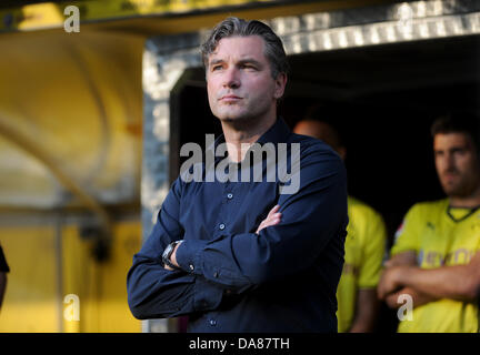 Dortmund's manager Michael Zorc stands on the sidelines before a test match between Bundesliga soccer club Borussia Dortmund and Sat.1 Heroes at Signal Iduna Park in Dortmund, Germany, 06 July 2013. The match, which was organized by television channel Sat.! under the motto 'The Duel - All against the BVB', marks the official start of the season 2013-14 for Dortmund. Photo: Jonas Guettler Stock Photo