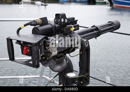 minigun mounted as close in weapon protection against small boat attacks on british royal navy warship Stock Photo