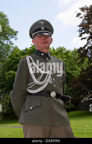 1940, 1941, 1942, 1943, 1944,  Wartime army man at Ingleton, UK. 7th July, 2013. Re-enactor dressed as German Hauptsturmführer a Nazi party paramilitary rank. Historical reenactment with German soldiers at Operation Home Guard, Ingleton’s 1940’s weekend when Ingleton became the German occupied French market town of La Chapell-De-Marais liberated by re-enactors. Stock Photo