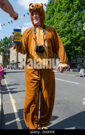 Charity collector in fancy costume posing for camera at Stow cum Quy ...