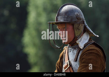 Chippenham, Wiltshire. 7th July, 2013. A English Civil War Society member is photographed in Monkton park as he takes part in the re-enactment of the Battle of Chippenham.They were re-enacting the battle for Chippenham that took place during the English civil war in 1643. Credit:  lynchpics/Alamy Live News Stock Photo