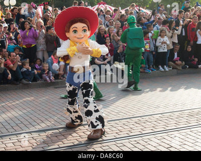 Jessie from Toy Story and a green army man take part in the Disneyland Paris, Disney Magic on Parade, parade Stock Photo